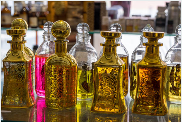 Decorative perfume bottles filled with golden oils